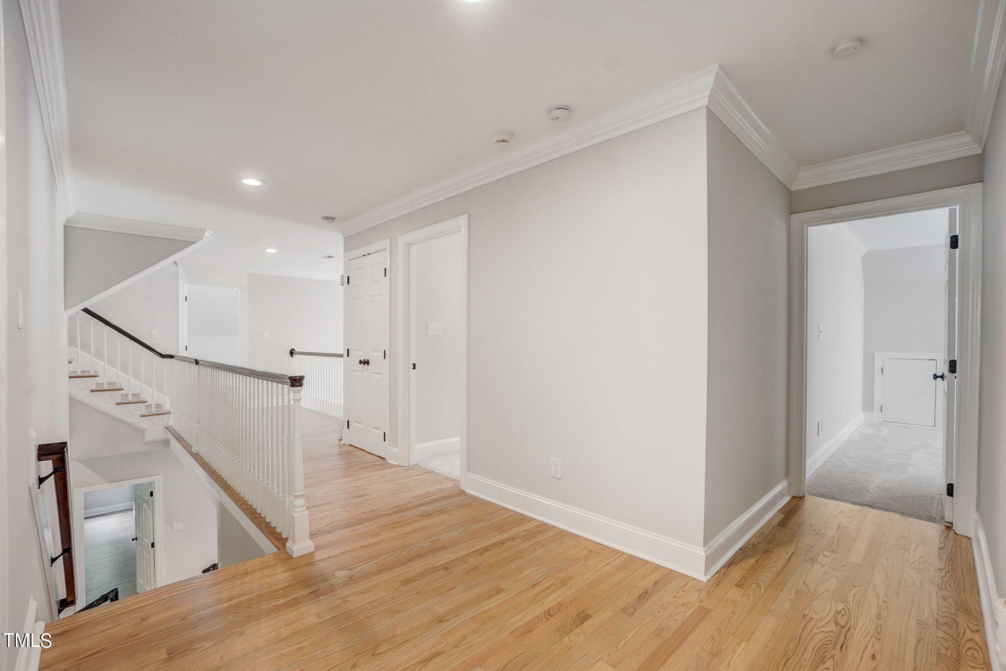 5101 Roseland Court Raleigh, NC 27613 - Photo 38 of 71 a view of a livingroom with wooden floor and staircase