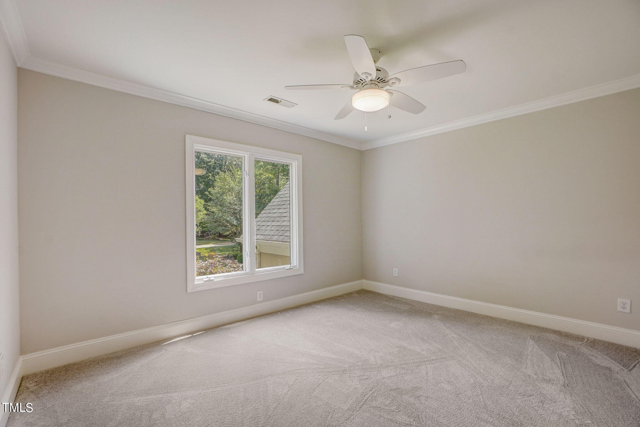 5101 Roseland Court Raleigh, NC 27613 - Photo 39 of 71 an empty room with a window and a fan