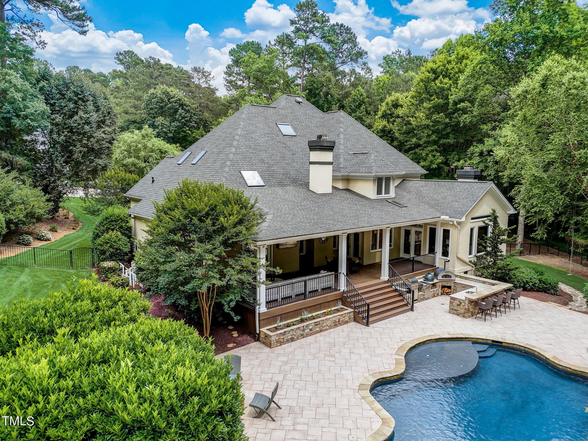 5101 Roseland Court Raleigh, NC 27613 - Photo 4 of 71 an aerial view of a house with swimming pool and furniture