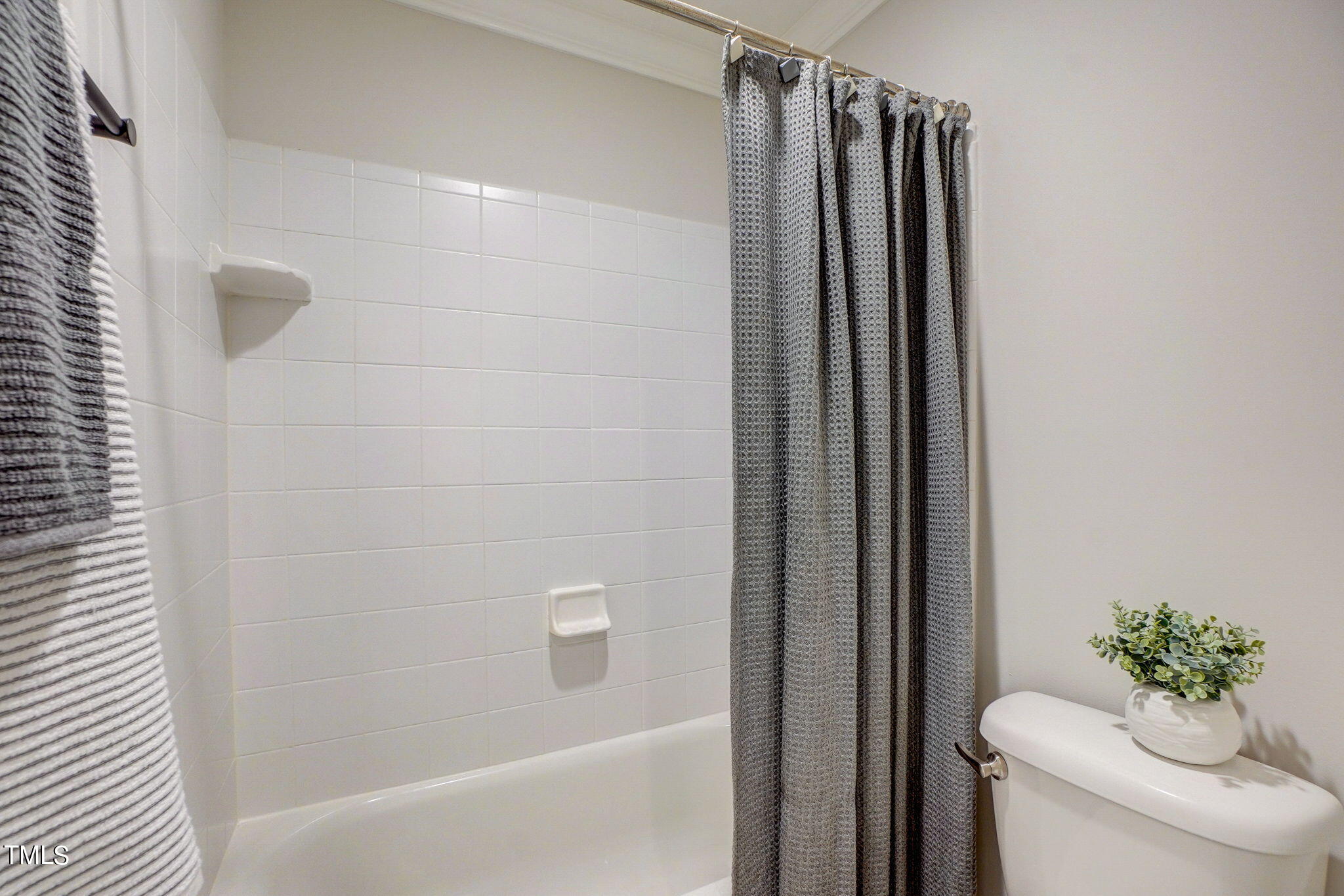 5101 Roseland Court Raleigh, NC 27613 - Photo 42 of 71 a bathroom with a shower and a sink