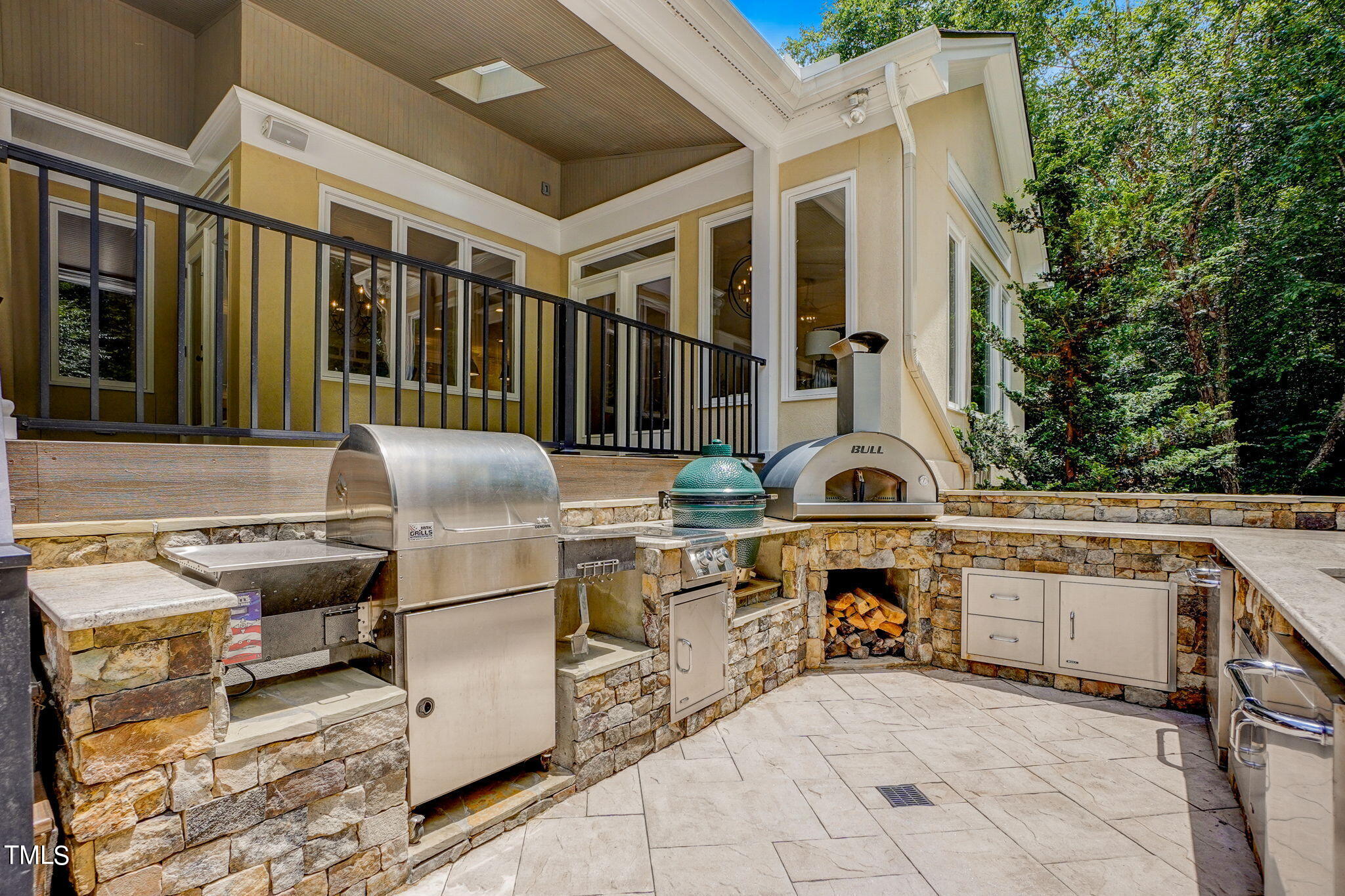 5101 Roseland Court Raleigh, NC 27613 - Photo 5 of 71 a view of a patio with couches chairs and potted plants