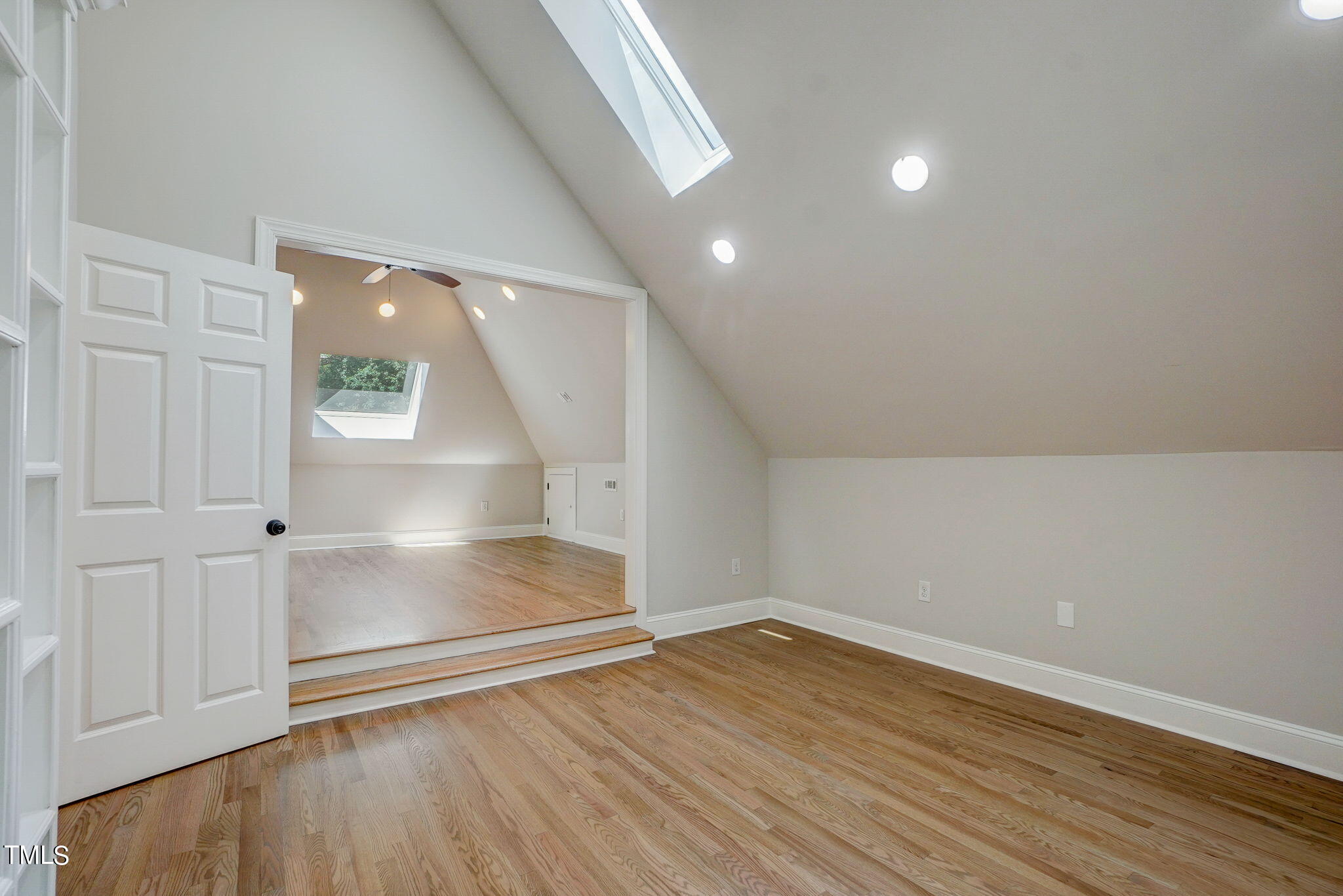 5101 Roseland Court Raleigh, NC 27613 - Photo 51 of 71 an empty room with wooden floor and windows