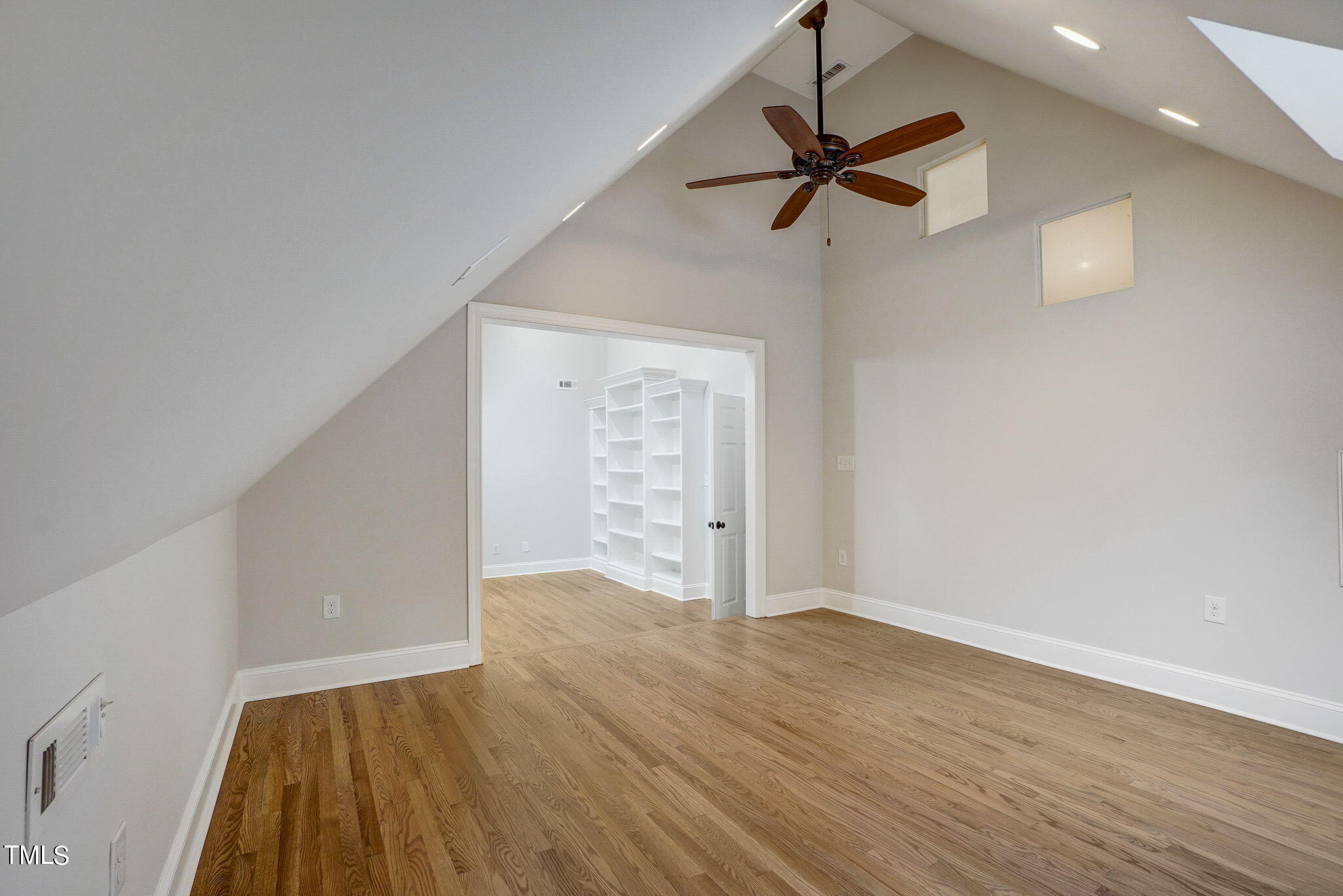 5101 Roseland Court Raleigh, NC 27613 - Photo 52 of 71 wooden floor in an empty room with a window