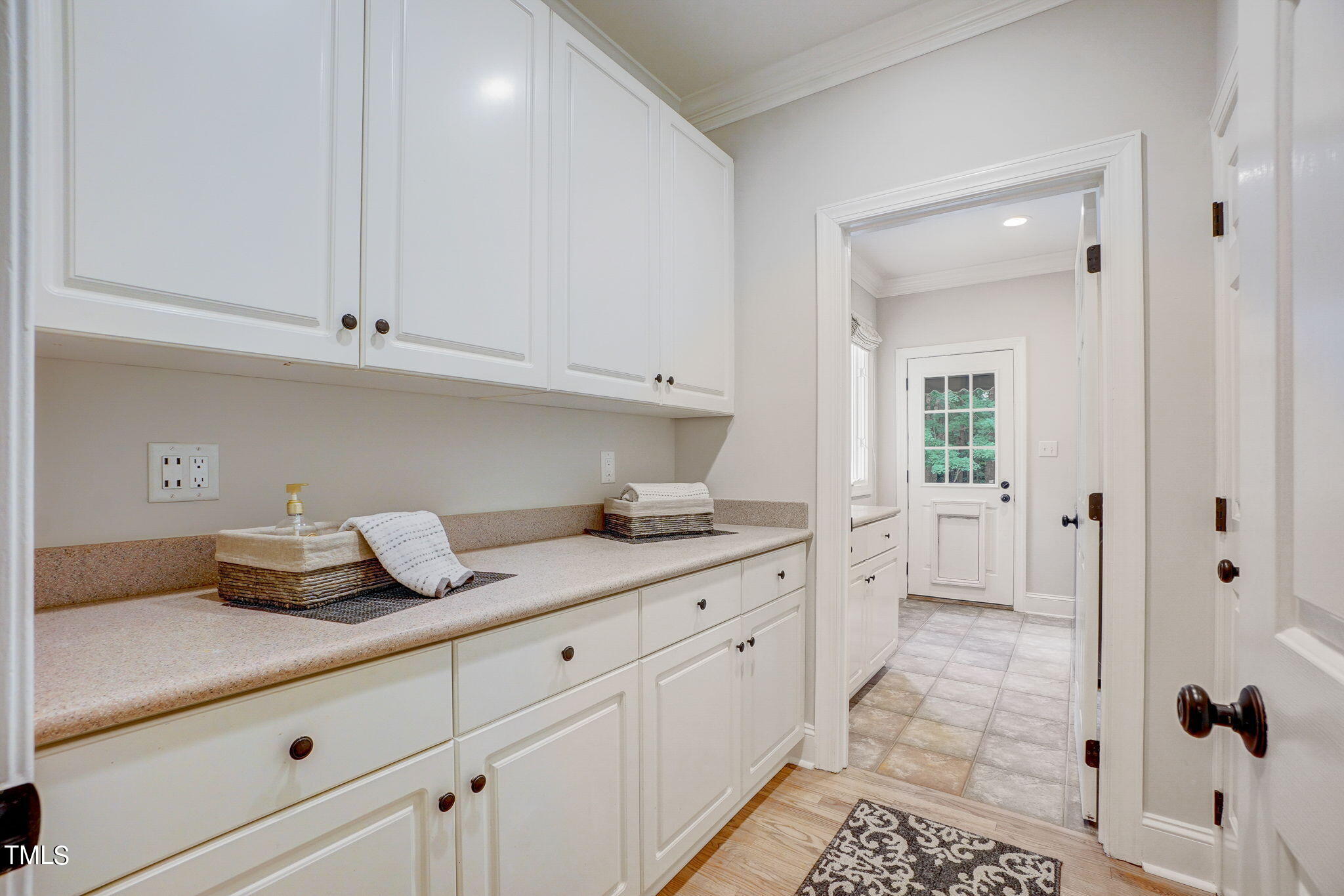 5101 Roseland Court Raleigh, NC 27613 - Photo 57 of 71 a kitchen with white cabinets and sink