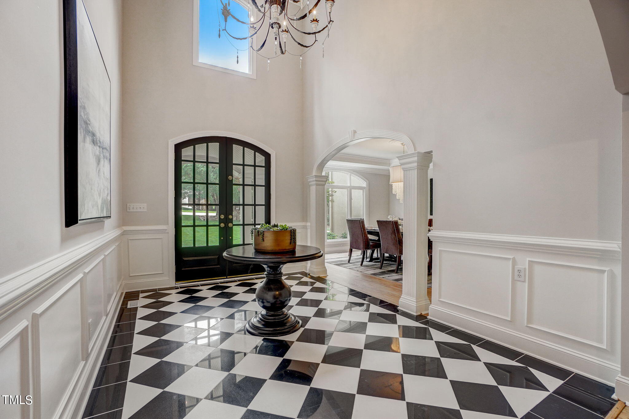 5101 Roseland Court Raleigh, NC 27613 - Photo 60 of 71 a room with a black white checkered floor with a gaming machine and a rug