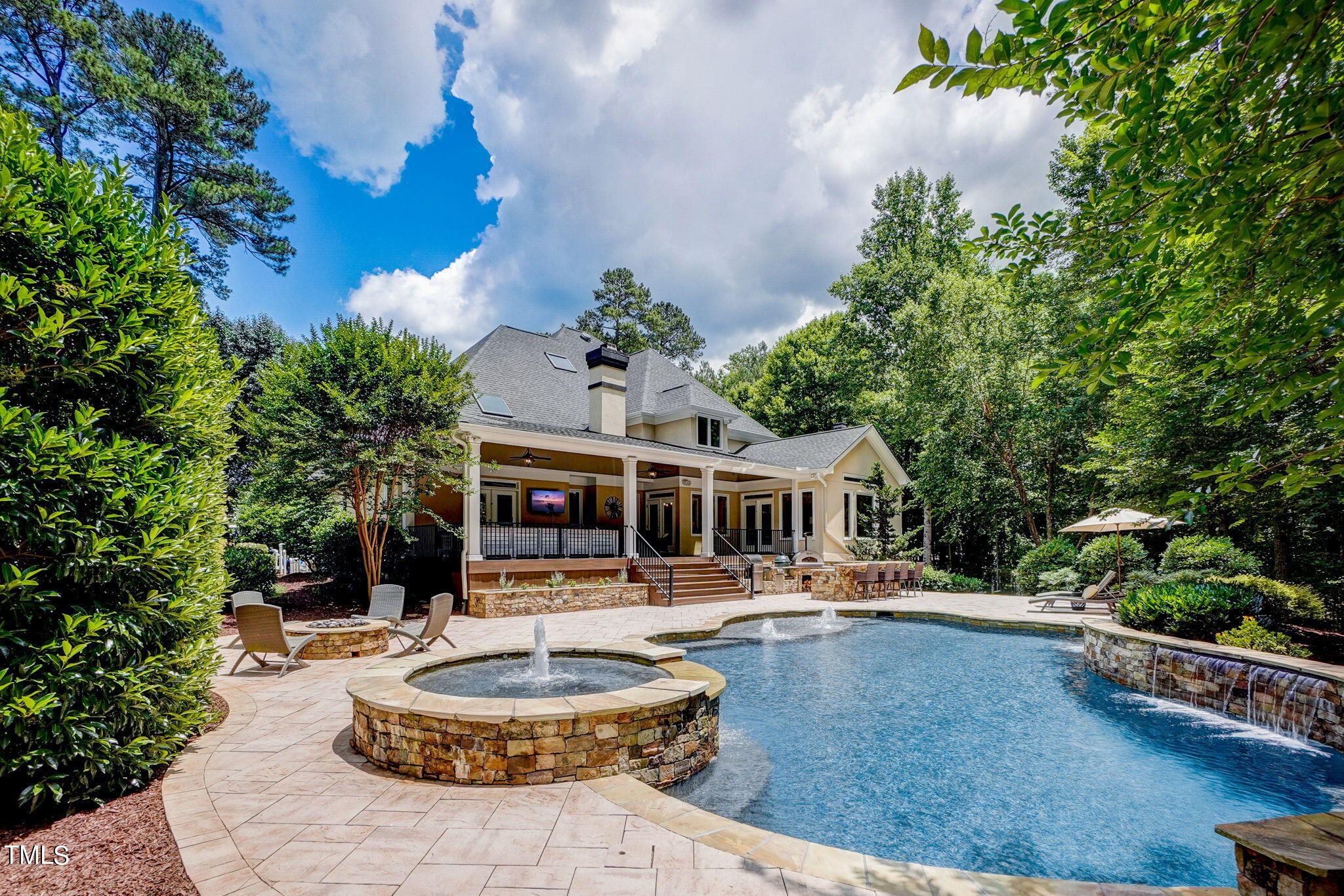 5101 Roseland Court Raleigh, NC 27613 - Photo 66 of 71 a front view of a house with garden and swimming pool