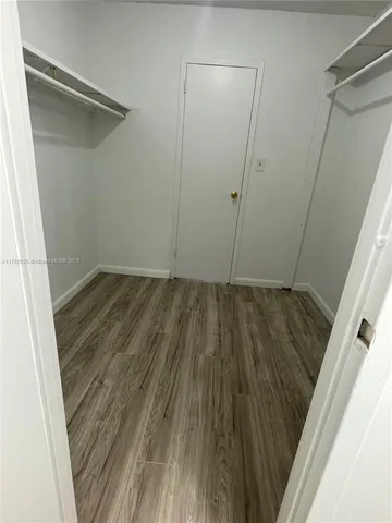 a white toilet and tub sitting next to a bathroom sink
