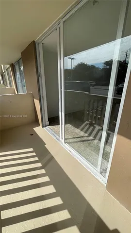 a kitchen with cabinets and window