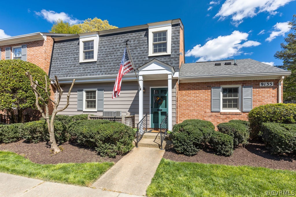 9135 Derbyshire Road, Unit G Henrico, VA 23229 - Photo 1 of 44 a front view of a house with garden