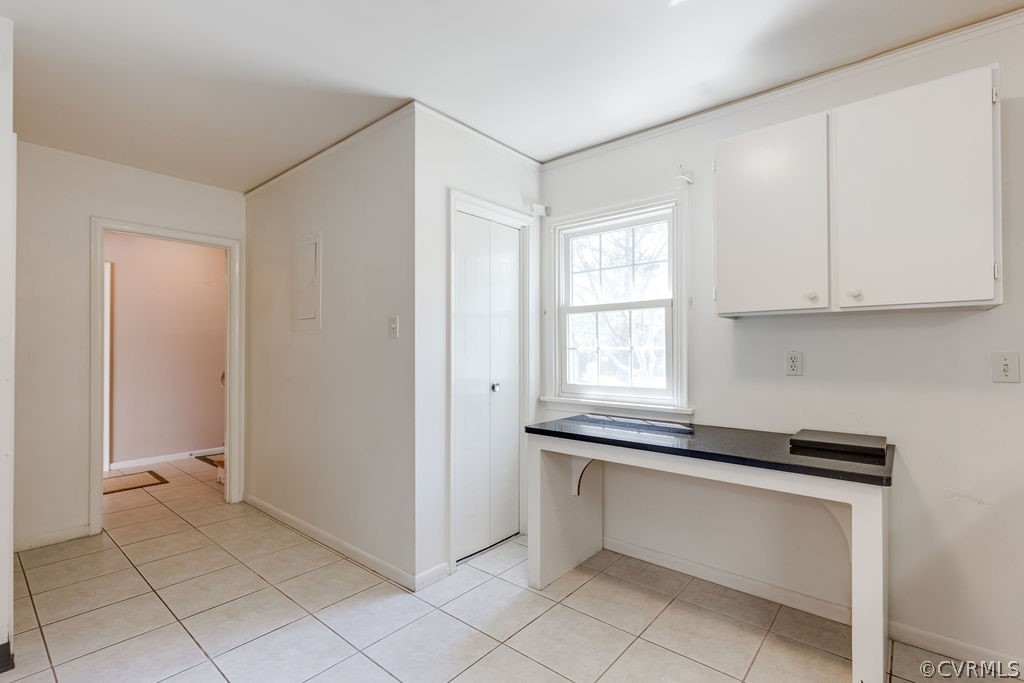 9135 Derbyshire Road, Unit G Henrico, VA 23229 - Photo 12 of 44 a kitchen with white cabinets and a window