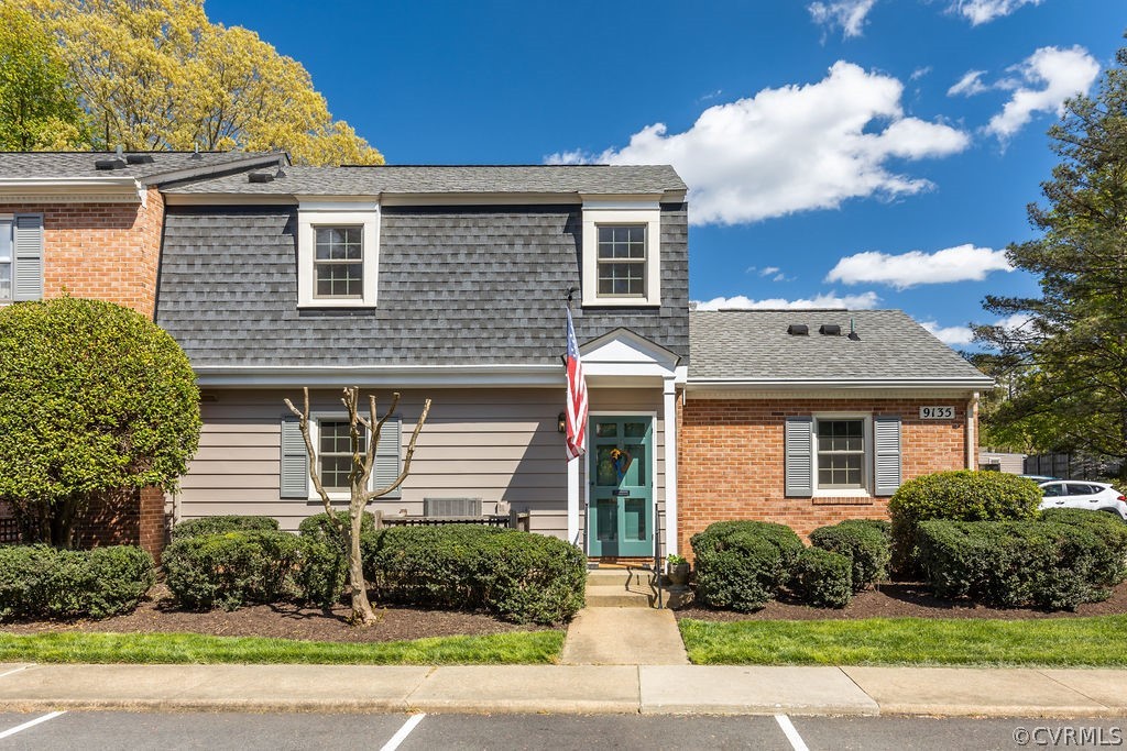 9135 Derbyshire Road, Unit G Henrico, VA 23229 - Photo 2 of 44 a front view of a house with a garden