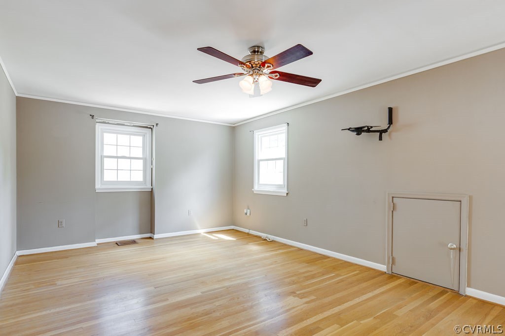 9135 Derbyshire Road, Unit G Henrico, VA 23229 - Photo 27 of 44 a view of a room with a ceiling fan and wooden floor