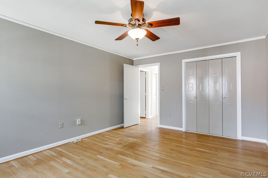 9135 Derbyshire Road, Unit G Henrico, VA 23229 - Photo 31 of 44 a view of an empty room with window and wooden floor