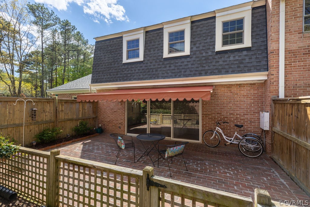 9135 Derbyshire Road, Unit G Henrico, VA 23229 - Photo 40 of 44 a view of a chair and table in the patio