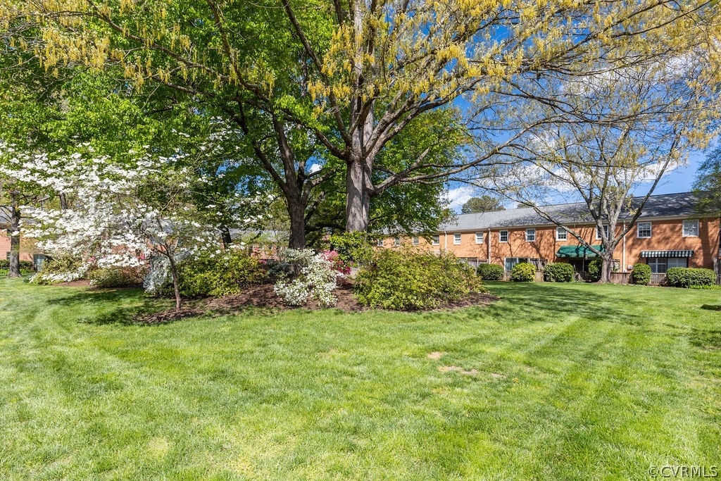 9135 Derbyshire Road, Unit G Henrico, VA 23229 - Photo 43 of 44 a view of a house with a yard