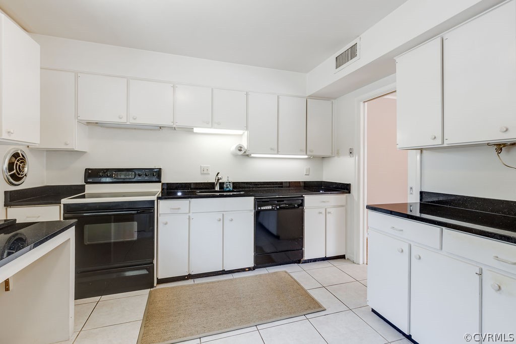 9135 Derbyshire Road, Unit G Henrico, VA 23229 - Photo 9 of 44 a kitchen with cabinets appliances and a sink