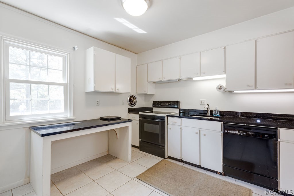 9135 Derbyshire Road, Unit G Henrico, VA 23229 - Photo 10 of 44 a kitchen with cabinets appliances a sink and a window