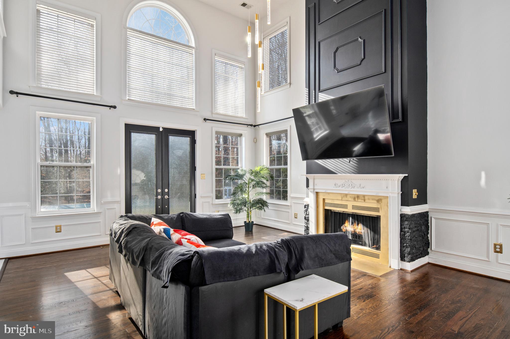 16301 Accolawn Road Accokeek, MD 20607 - Photo 20 of 77 a living room with furniture a fireplace and a flat screen tv