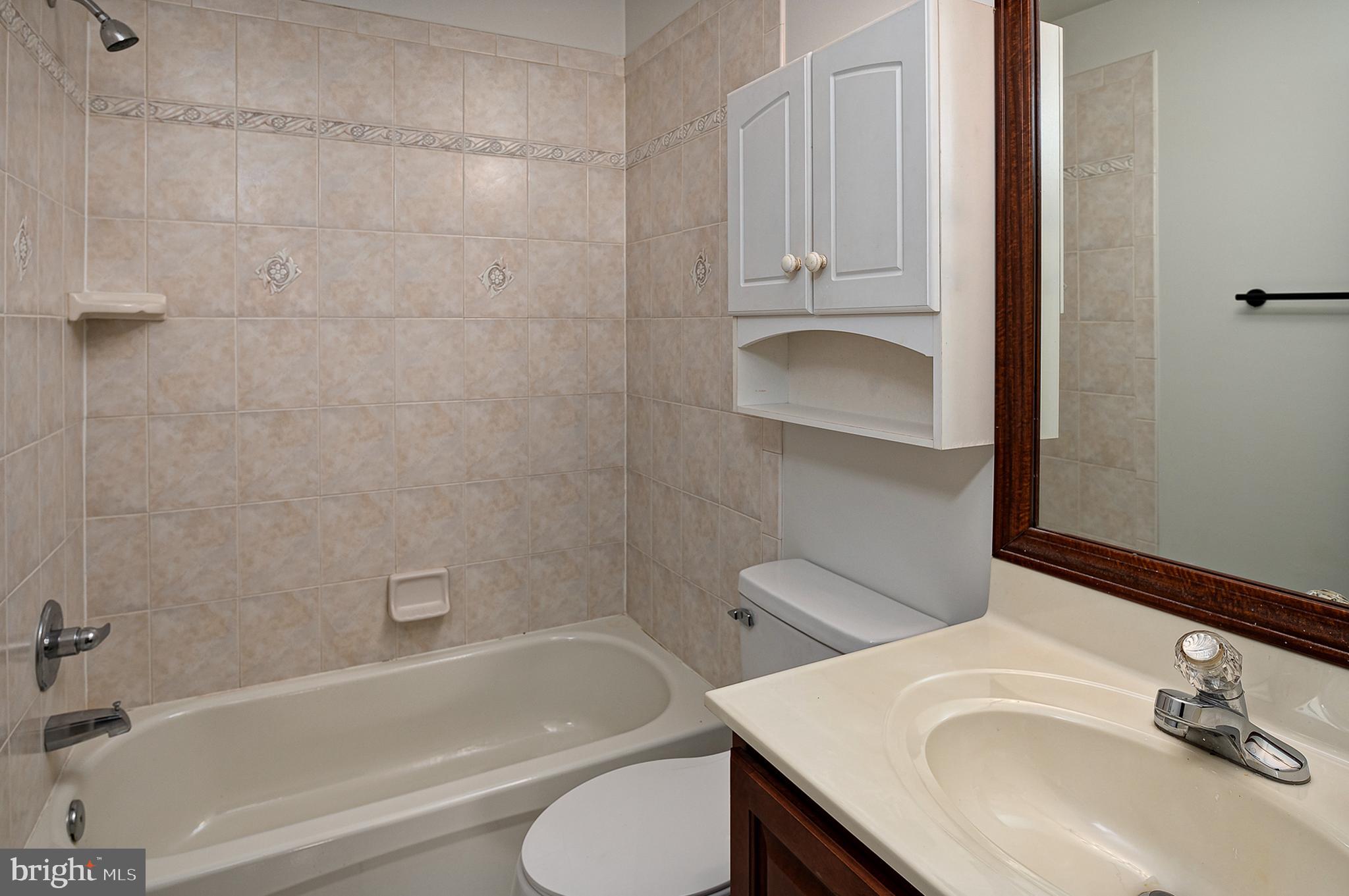 16301 Accolawn Road Accokeek, MD 20607 - Photo 44 of 77 a bathroom with a sink toilet vanity and bathtub