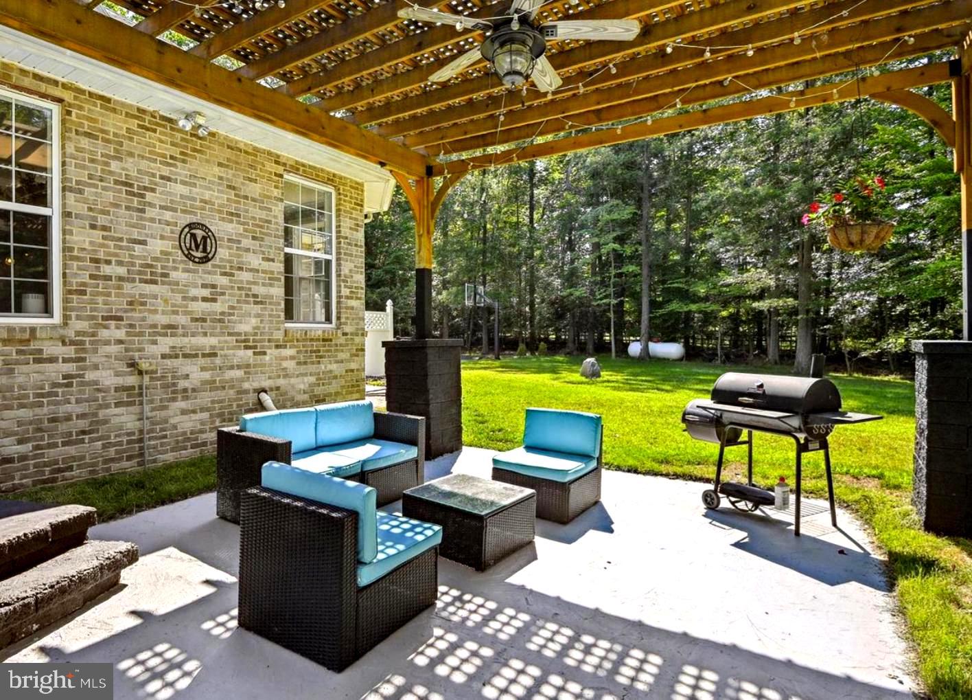 16301 Accolawn Road Accokeek, MD 20607 - Photo 70 of 77 a view of a patio with a table and chairs