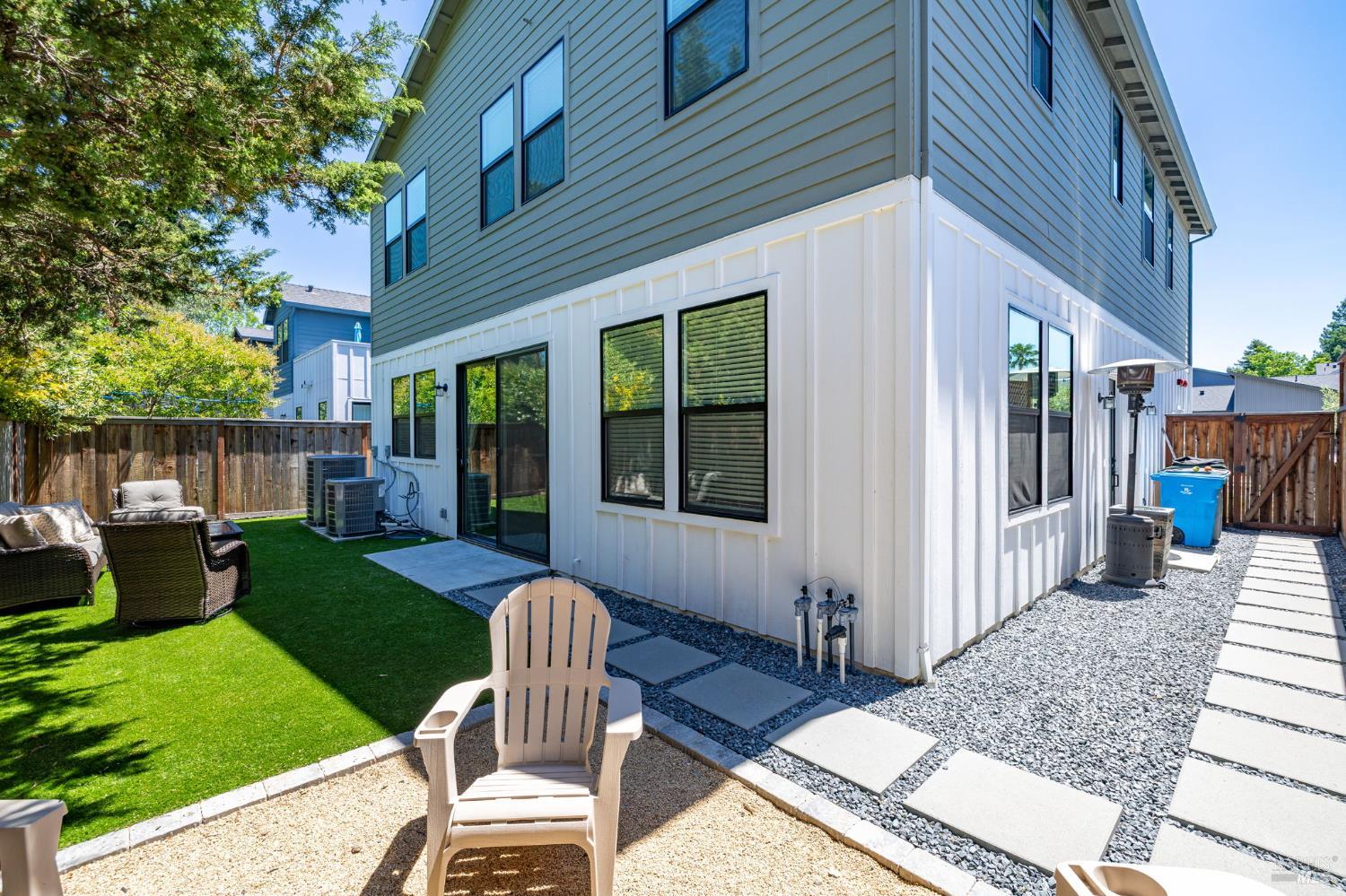2215-2217 Versaro Drive Santa Rosa, CA 95403 - Photo 39 of 45 a view of a house with backyard porch and furniture