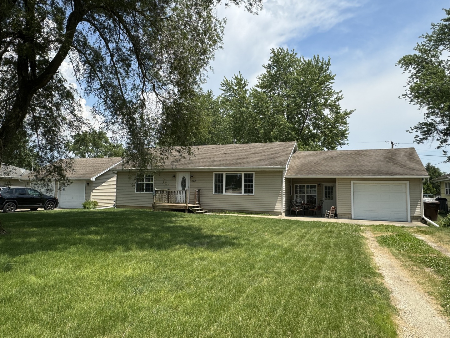 374 North Park Road Herscher, IL 60941 - Photo 1 of 16 a house that is sitting in the grass with tress in the background