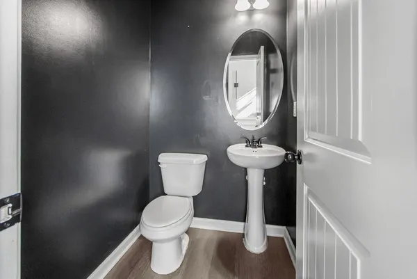 a bathroom with a toilet and a sink