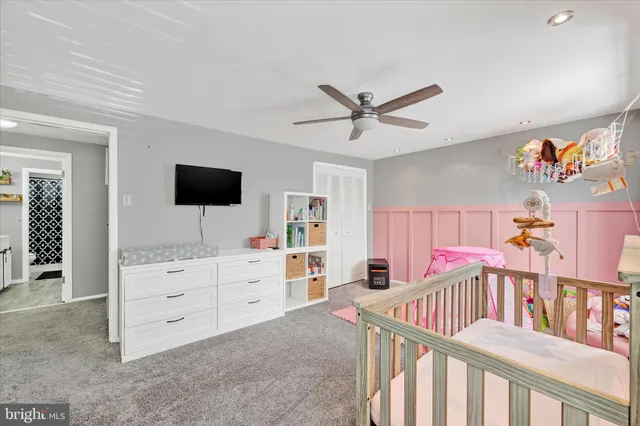 a view of a livingroom with furniture and a flat screen tv