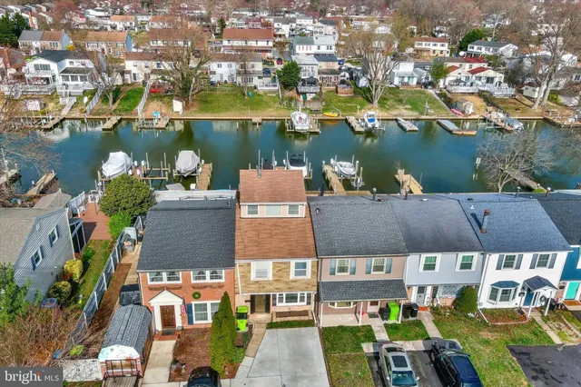 an aerial view of a house with a lake view