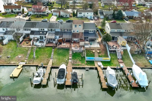an aerial view of a house with outdoor space lake view