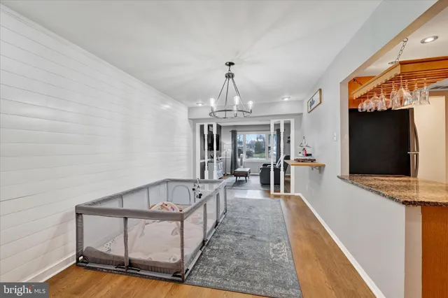 a view of a living room and kitchen