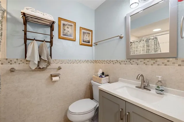 a bathroom with a toilet sink and shower