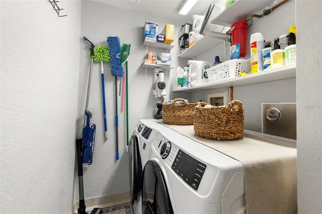 a living room with furniture flowerpot and wooden floor