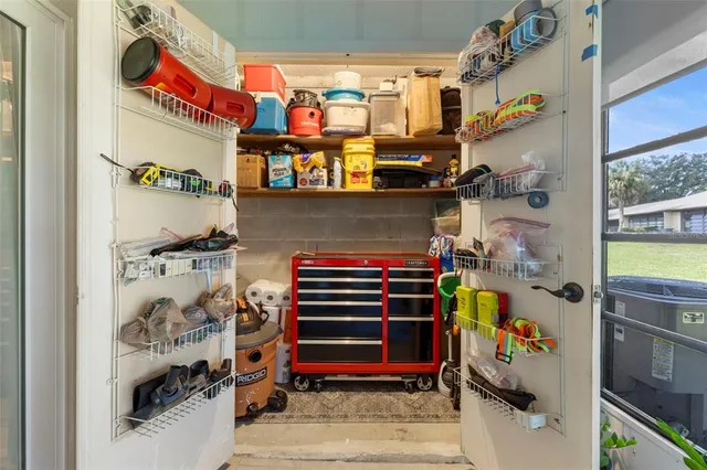 a view of a house with backyard porch and sitting area
