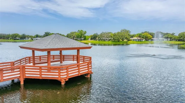 an aerial view of a house with a lake view
