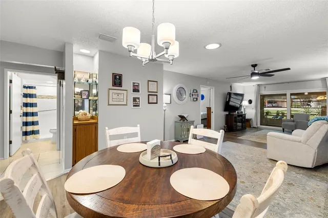 a view of a livingroom with furniture and a bookshelf