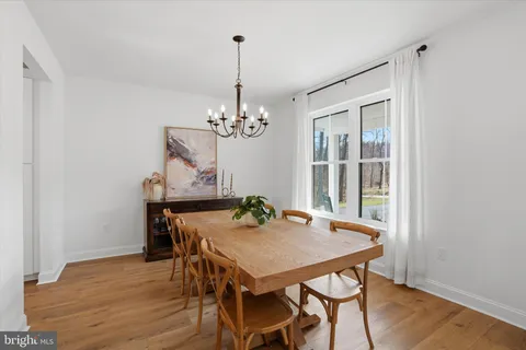 a kitchen with a table and chairs in it