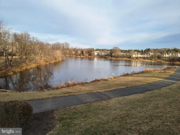 a view of lake with green space