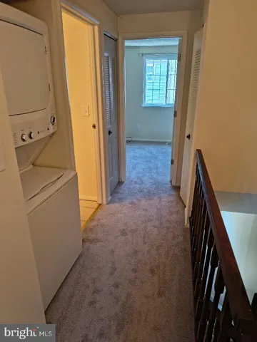 a view of hallway with washer and dryer