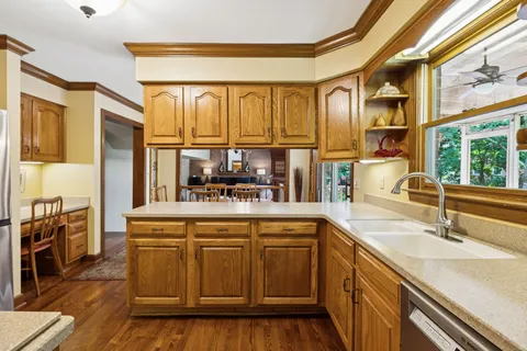 a kitchen with a sink and cabinets