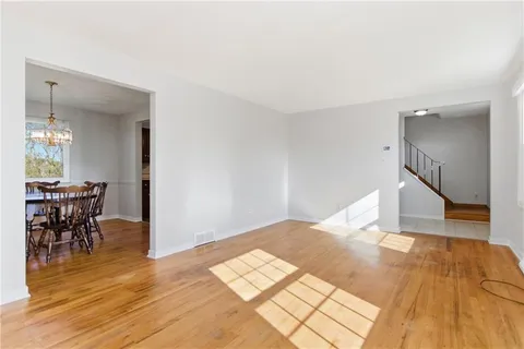 a view of a livingroom with furniture and wooden floor