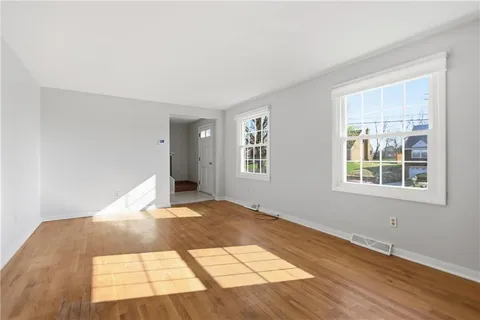 a view of an empty room with windows