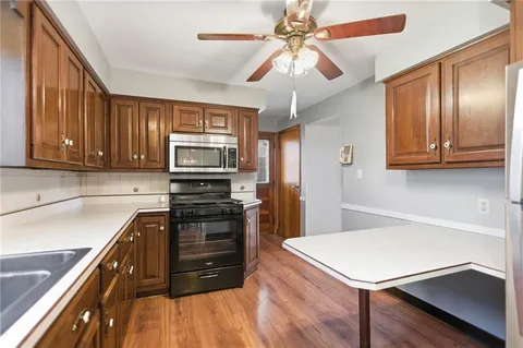 a kitchen with a appliances