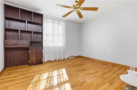 a bedroom with a bed and closet