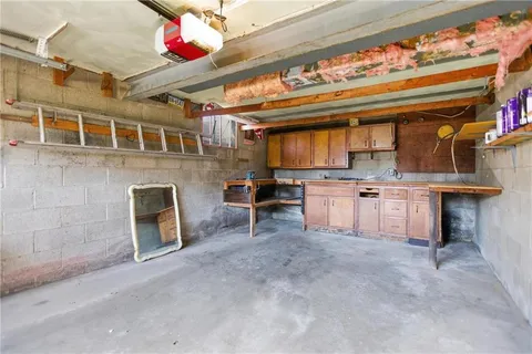 a kitchen with a stove and a fireplace