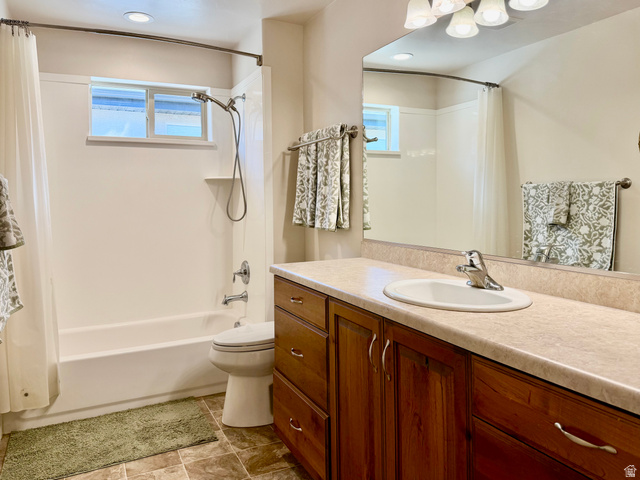 1204 South 1150th Street West Payson, UT 84651 - Photo 9 of 26 Guest Full Bathroom featuring a wood-finish vanity with a single sink, a large wall-mounted mirror, and overhead vanity lighting