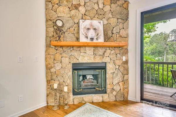 a stone house with a fireplace and a window