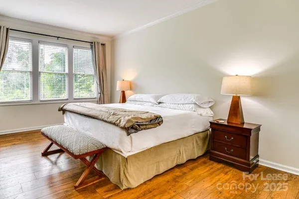 a bedroom with a bed and a table in it