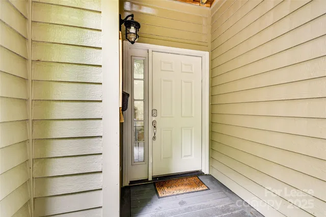 a view of a wooden door and wooden floor