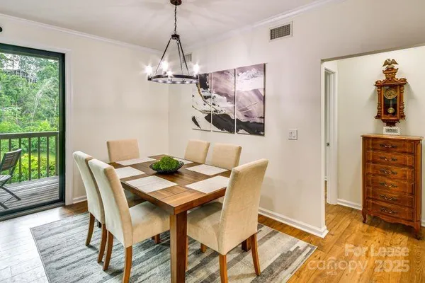 a view of a dining room with furniture window and outside view